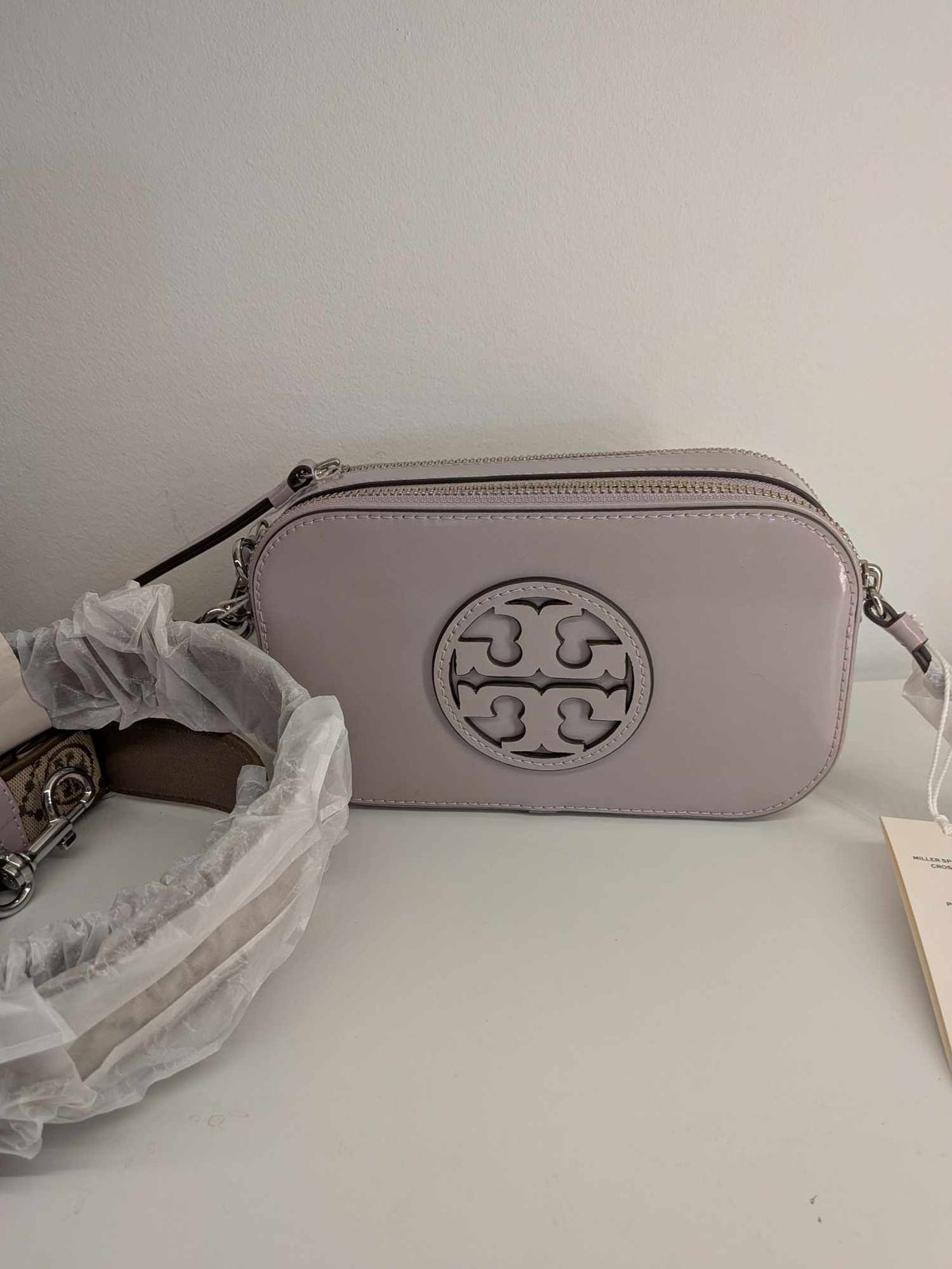 110580705-2 Tory Burch Mini Miller Spazzolato Leather Crossbody Bag in a light pink/primrose 10011011