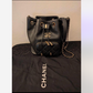 Chanel Drawstring Bucket Black Caviar Gold Hardware